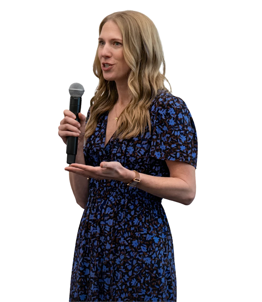 Morgan Depenbusch speaking into a microphone and gesturing as she teaches